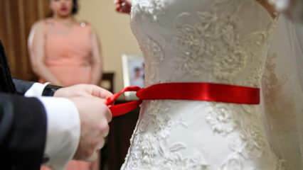 Quelle est la signification du ruban rouge? Pourquoi la ceinture rouge est-elle attachée à la mariée?